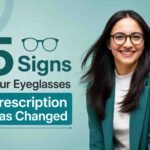 Smiling woman wearing eyeglasses, representing common signs that your eyeglasses prescription has changed and may need an updated eye exam.