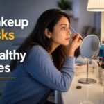 Woman applying eye makeup in front of a mirror, highlighting potential makeup-related risks to healthy eyes and the importance of proper eye makeup hygiene.